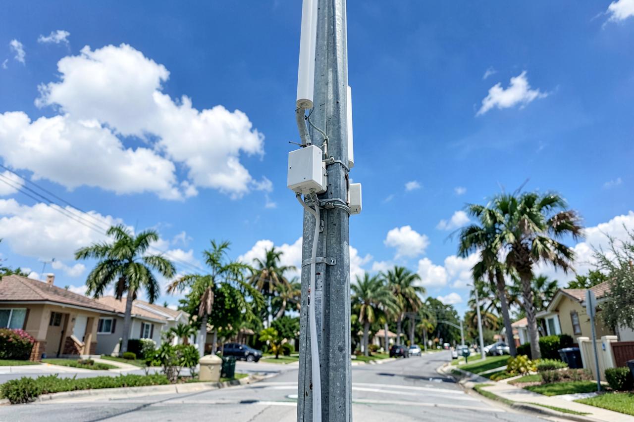 5G small-cell antenna mounted on a street light pole in a Florida residential street